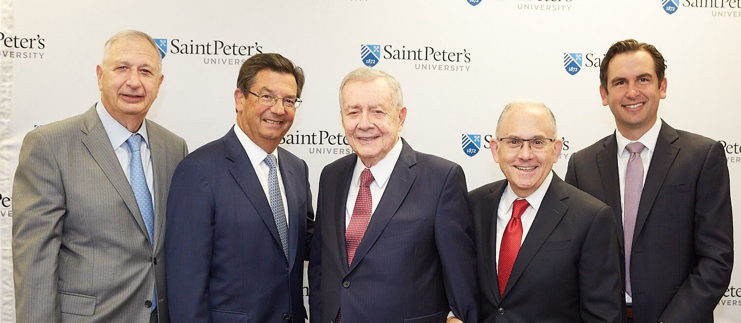 From left, Joseph Panepinto, ’66, president and CEO of Jersey City-based Panepinto Properties and a member of the Saint Peter’s Board of Trustees; Frank Fekete, ’75, managing partner of Mandel, Fekete & Bloom CPAs; Frank Guarini, H ’94; Eugene Cornacchia, P president of Saint Peter’s University; and Jersey City Mayor Steven Fulop, H ’14, together in September 2019 to announce the Frank J. Guarini School of Business at Saint Peter's University.