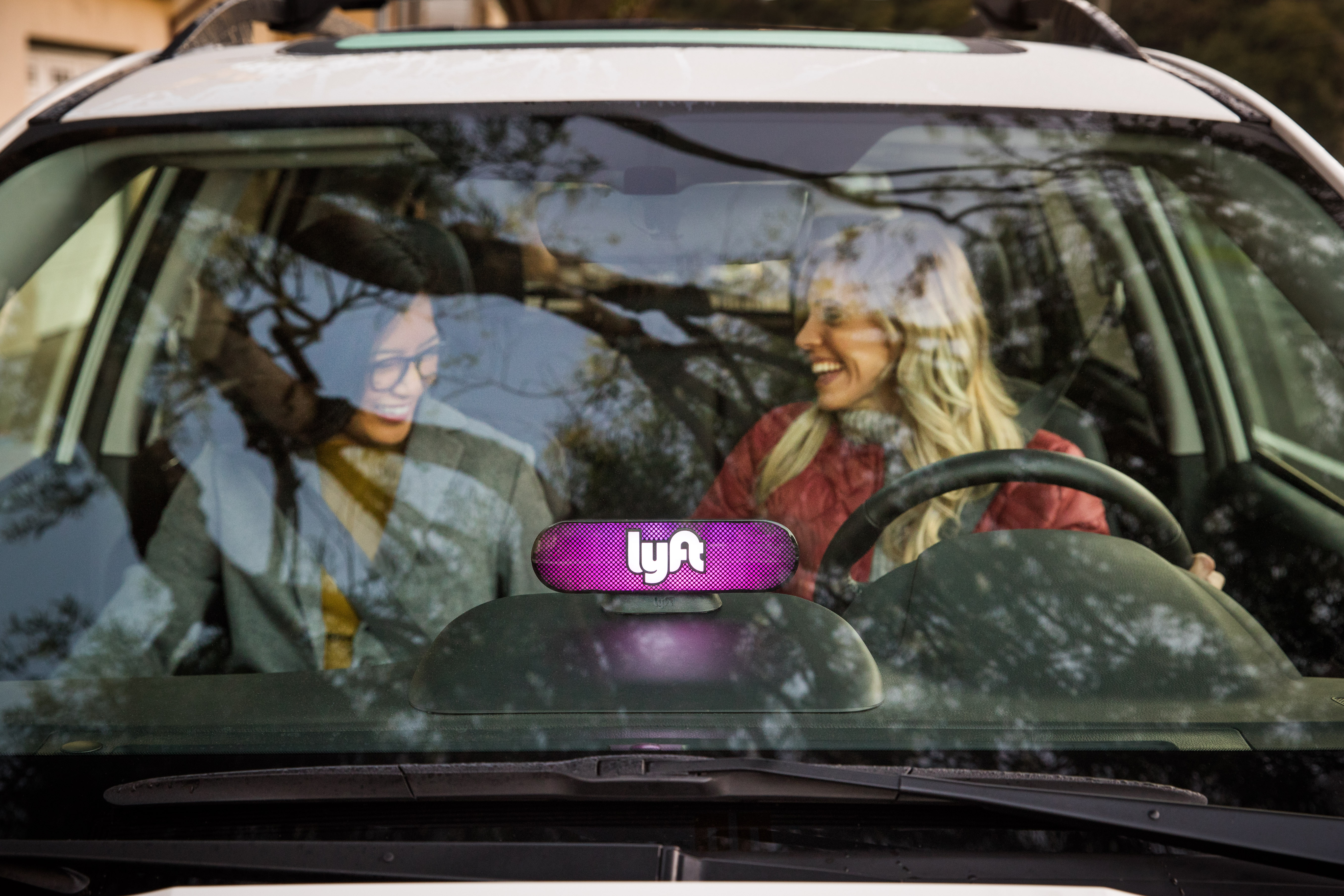 A Lyft driver and passenger. -LYFT
