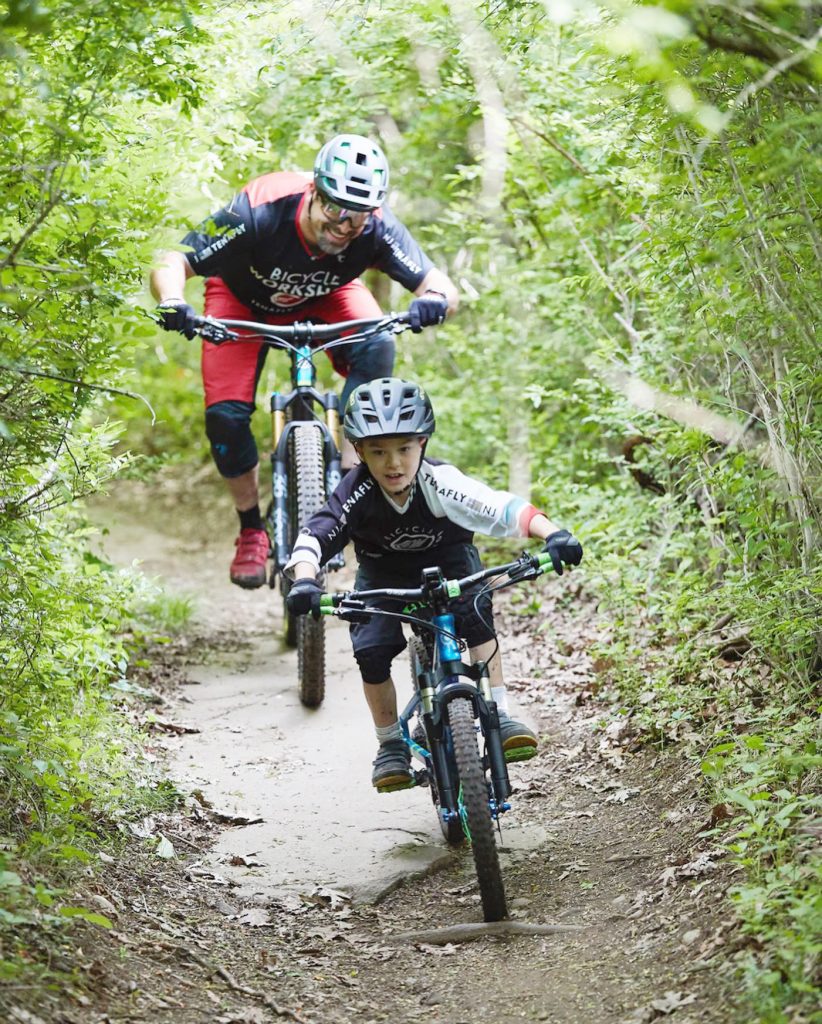 Tenafly Bicycle Workshop owner Shephard Grinker riding trails with Noah Grinker in Alpine.