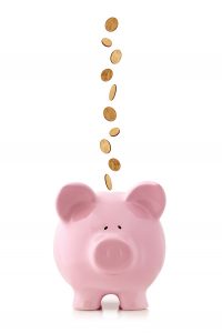 Golden coins falling into a pink piggy bank, isolated on white. US dollar coins // The merger with Mariner's Bank grows Spencer Savings Bank to approximately $4.0 billion in assets, $3.1 billion in loans, and $3.2 billion in deposits with 26 branches in New Jersey.