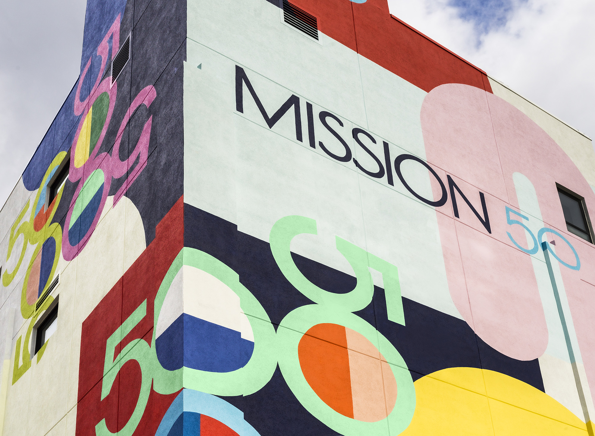 Mural Painter Inc. created the eye-catching exterior made up of Mission 50 in Hoboken's signature logo, as well as murals throughout the building’s internal stairwells.- QUALLSBENSON