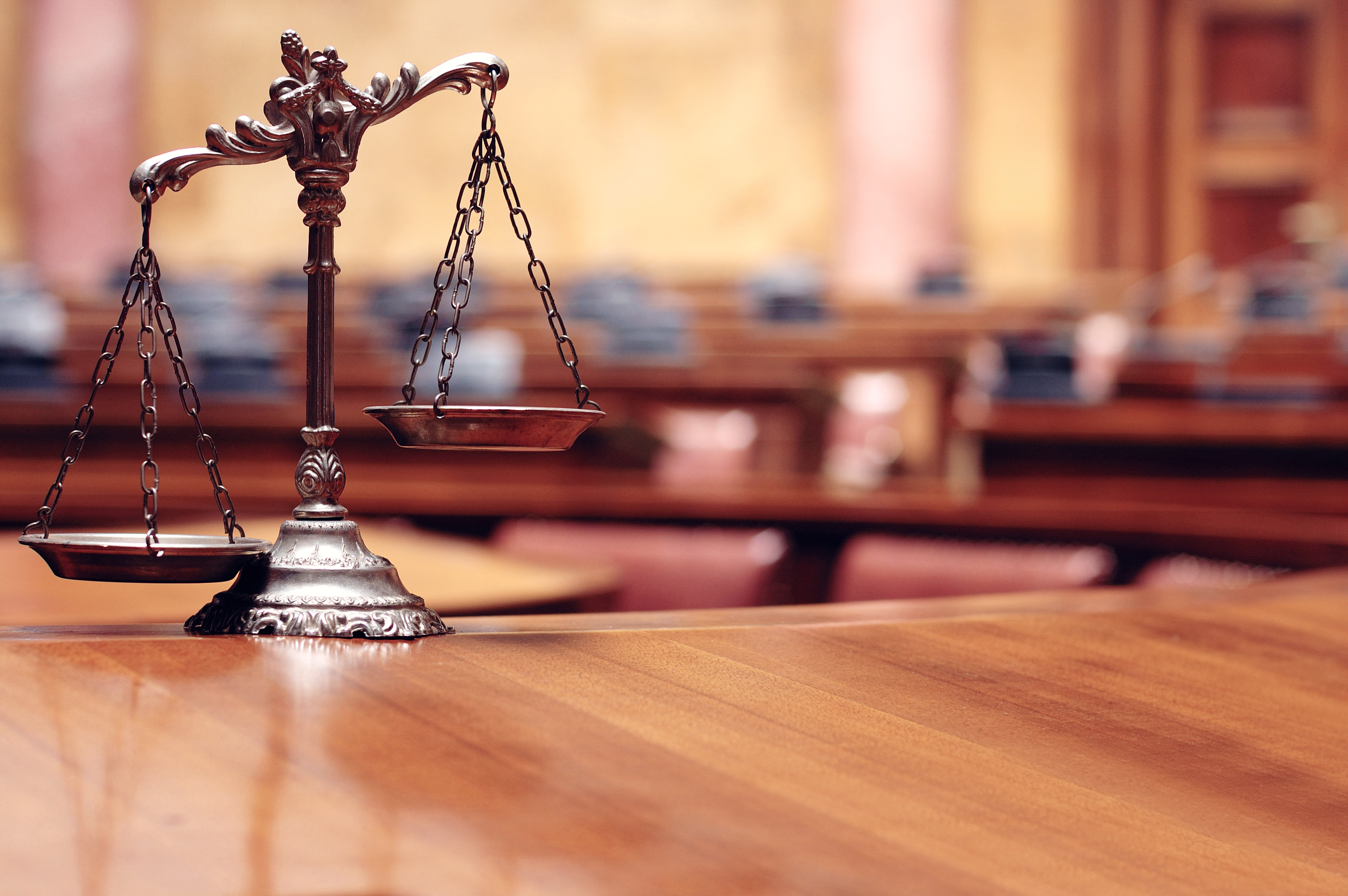 Symbol of law and justice in the empty courtroom, law and justice concept.