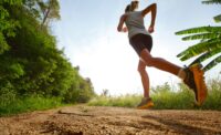 Young lady running on a rural road