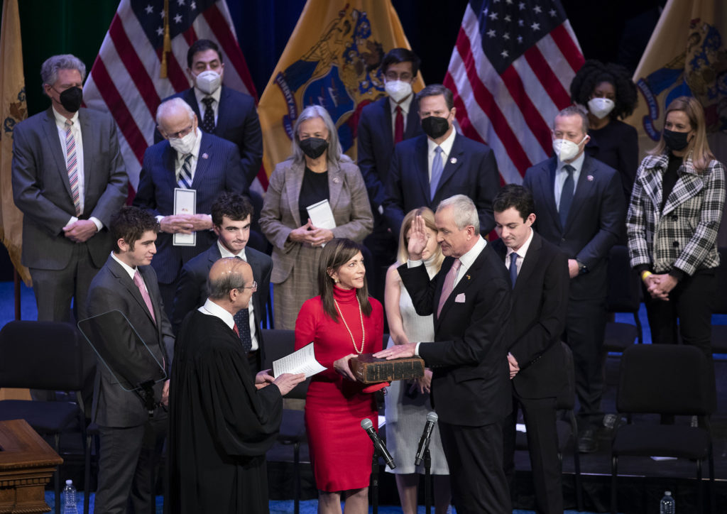 Gov. Phil Murphy takes the oath of office for governor, administered by New Jersey Supreme Court Justice Stuart Rabner, at the War Memorial in Trenton on Jan. 18, 2022.