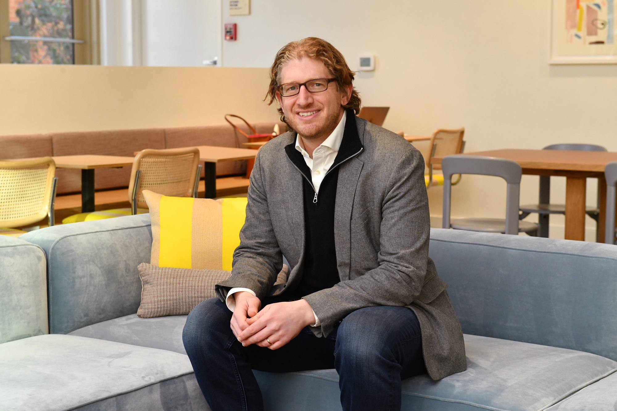 Daybase CEO Joel Steinhaus poses at the first Daybase hybrid work spot on Washington Street in Hoboken on Jan. 26, 2022.