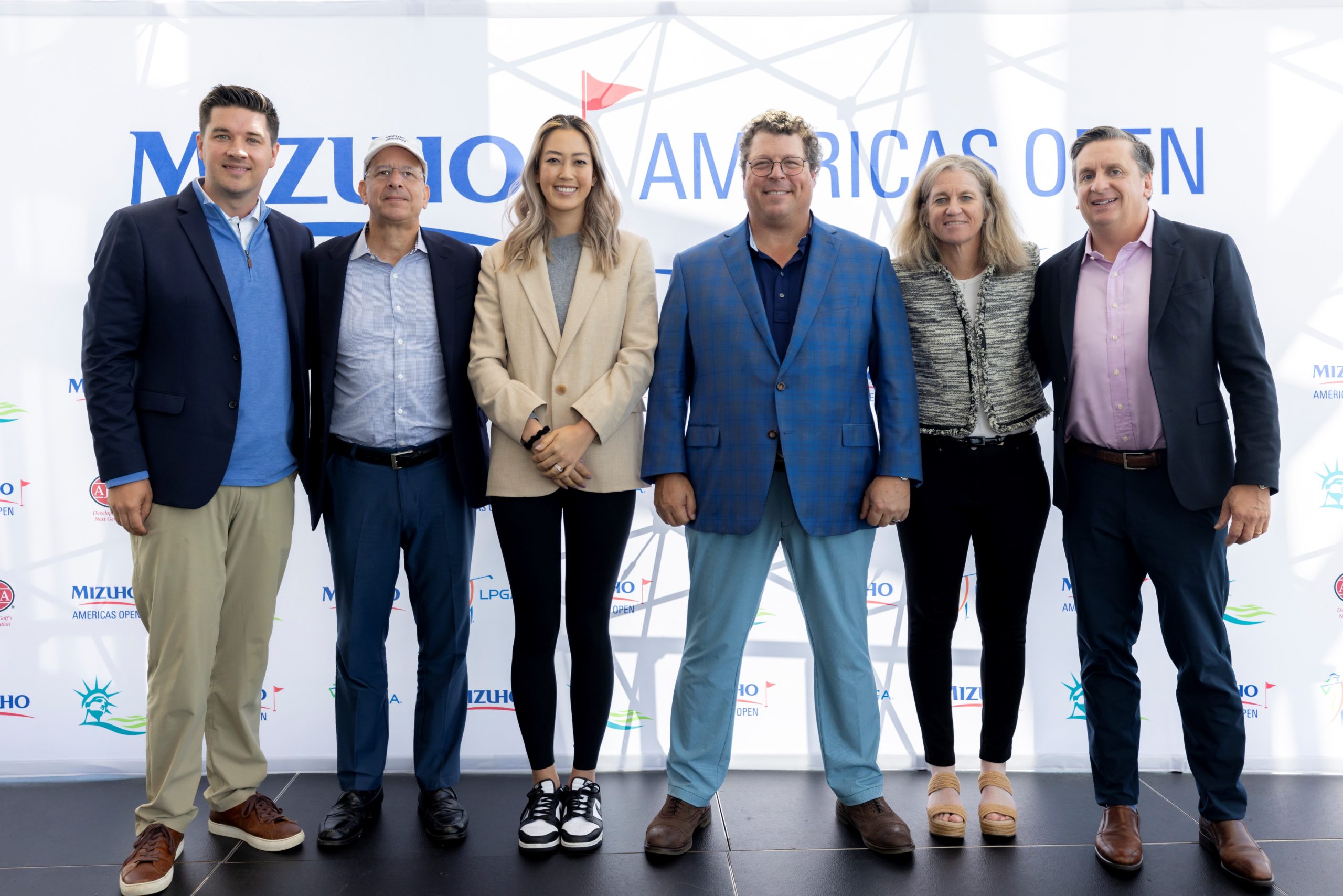 From left: Excel Sports Management Vice President Kevin Hopkins; Mizuho Securities USA President and CEO and Head of CIB for Mizuho Americas Jerry Rizzieri, LPGA player and Mizuho Ambassador Michelle Wie West, Liberty National Golf Club co-Founder and President Dan Fireman, LPGA Commissioner Mollie Marcoux Samaan and American Junior Golf Association Chief Business Officer Jason Etzen celebrate the announcement of the inaugural Mizuho Americas Open, which will take place in 2023 at Liberty National in Jersey City.