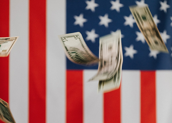 Money in front of the American flag