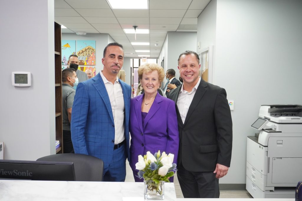 From left, Dr. Nizar Kifaieh, president and CEO for Hudson Regional Hospital; Joan Quigley, president and CEO for North Hudson Community Action Corp.; and Joseph Muniz, NHCAC board chair pose during the Jan. 24, 2023, ribbon-cutting celebrating NHCAC's debut at HRH in Secaucus.