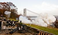 An American Revolution re-enactment takes place in front of the George Washington Bridge at Fort Lee Historic Park.