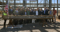 U.S. Rep Bonnie Watson Coleman is flanked by local elected officials and BeiGene employees during a beam signing ceremony on March 21, 2023, at the Princeton West Innovation Campus in Hopewell, where the company is building a new facility that will provide state-of-the-art commercial-state U.S. biologic pharmaceutical manufacturing, late-state research and clinical development capabilities.