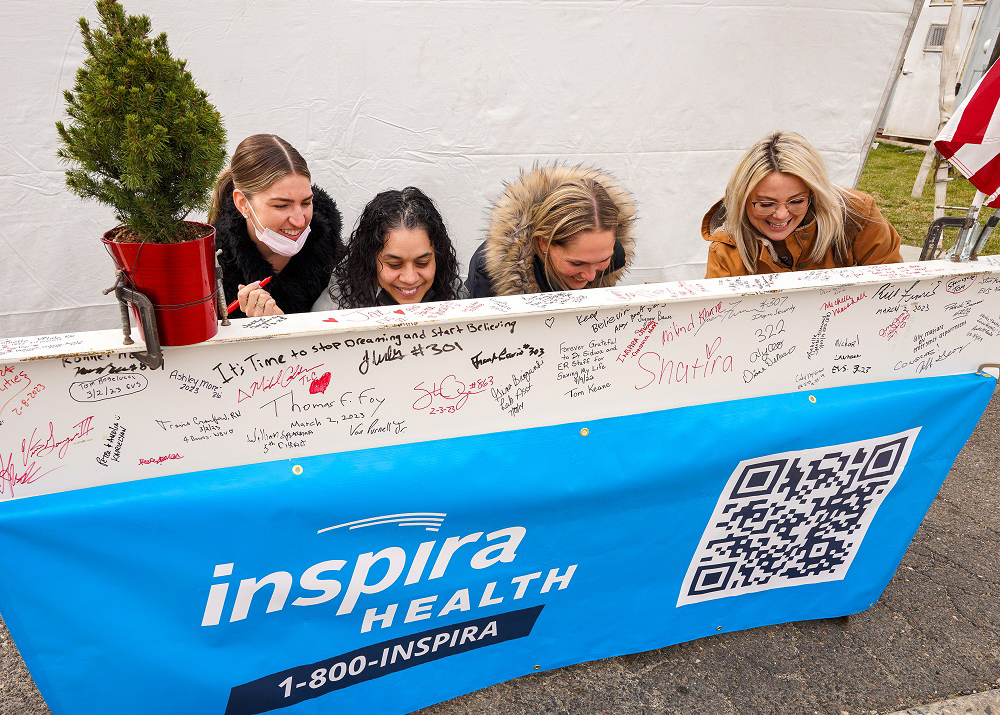 Inspira Health employees, along with state, county and municipal officials, signed the final steel beam at the Topping Off Ceremony on Inspira Health's Woodbury campus.