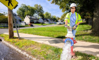 New Jersey American Water’s Deresha Ship flushes a hydrant in the company’s Plainfield service area.