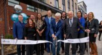 Executives and township officials cut the ribbon at luxury apartment community Max on Morris on March 22, 2023. - THE HAMPSHIRE COS.