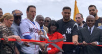 Paterson Mayor Andre Sayegh is joined by officials and fans to cut the ribbon, opening Hinchliffe Stadium.
