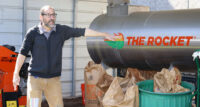 Bergen Community College professor PJ Ricatto – demonstrating the operation of the “Rocket” food composter at the college’s main campus – will lead the implementation of a $4.5 million USDA grant that will prepare students for careers in agricultural fields.
