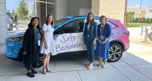 From left, First Ladies Rose Dunleavy, of Alaska; Tammy Murphy, of New Jersey; Abby Palmer Cox of Utah; and Susan McKee of Rhode Island pose with the Safe Beginnings automobile. - ATLANTICARE