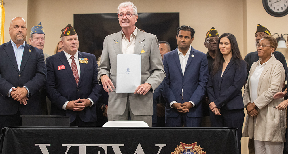 At the Veterans of Foreign Wars Harold Daley Post 1333 in Neptune City on Aug. 25, 2023, Gov. Phil Murphy signed a law making it a violation of the Consumer Fraud Act for individuals to receive compensation for advising or assisting with veterans benefits.