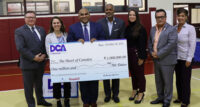 Celebrating Heart of Camden’s $1 million grant are (from left) Mark McDonough, president of New Jersey American Water; Kate Barrett, Campbell Soup Co.’s director of community affairs and president of The Campbell’s Foundation; Carlos Morales, executive director of Heart of Camden; Camden Mayor Vic Carstarphen; Jacquelyn Suárez, acting commissioner of the Department of Community Affairs; and Camden City Council members Angel Fuentes and Jannette Ramos.