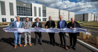 From left, Crow Holdings Development Vice President-Industrial Brad Vander Vliet, Carteret Borough Chief of Staff Frank Bellino, Borough Council President AJ Johal, Mayor Daniel Reiman, CHD Senior Managing Director Clark Machemer and Borough Council Member Vincent Bellino at the Nov. 2 debut of Crow Holdings at Carteret, a 1.2 million-square-foot industrial development located off of Exit 12 on the New Jersey Turnpike. - CROW HOLDINGS DEVELOPMENT