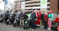 Dr. Jonathan Teitelbaum (center, in tan pants), chair of pediatrics at The Unterberg Children’s Hospital, ride organizer Bill Blakely of Creative Performance (center, in plaid shirt) and Dr. Robert Zanni (in front of green motorcycle), chief of pediatric pulmonology gather with riders from the Blue Knights NJ XV and Jersey Shore HOGs and local police departments for the 14th Annual Toy Run.