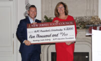 New Jersey Food Council board Chairman Andrew Kent, of Glass Gardens ShopRite, presents NJFC President Linda Doherty with a $5,000 check for the inaugural NJFC President’s Scholarship.
