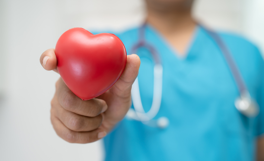 Health care provider holding heart