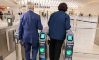 Port Authority of New York and New Jersey Executive Director Rick Cotton and PATH General Manager and Director Clarelle DeGraffe try out the Total Access PATH Payment (TAPP) system March 20, 2024, at the World Trade Center, the system’s busiest station. The Port Authority announced that TAPP has now been expanded to six terminal stations in the PATH system, allowing passengers to pay their fares at select turnstiles with the tap of a contactless debit/credit card, smartphone, or wearable device. - PROVIDED BY PANYNJ