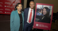 Lt. Gov. Tahesha Way (left) and James Jones, co-director of the Sheila Y. Oliver Center for Politics and Race in America at Rutgers-Newark, stand next to a portrait of the late lieutenant governor.
