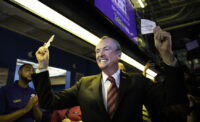 Gov. Phil Murphy places the state’s first sports bets at Monmouth Park in 2018.