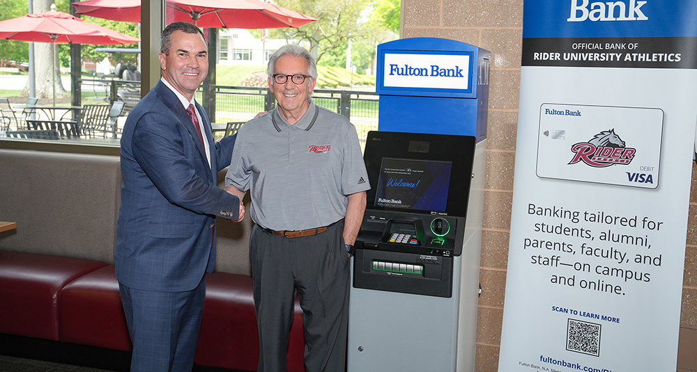 From left: Fulton Bank CEO Curt Myers and Rider University President Gregory Dell'Omo show off the new Fulton Bank ATM in the university's student recreation center.