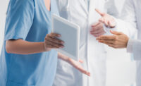Doctors discuss a patient's records