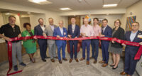 Cooper University Health Care leaders and staff of the Center for LGBTQ+ Health at Cooper join for a ribbon-cutting ceremony of the new office.