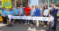 AtlantiCare president and CEO, Michael Charlton, far right, joins other leaders from AtlantiCare as well as state and local political offices in cut ting the ribbon to mark the official opening of the AtlantiCare Community Mobile Market. - PROVIDED BY ATLANTICARE