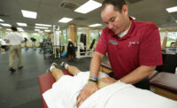 At JAG Physical Therapy, Clinical Director of the West Orange Facility Dan Kane works on a patient with lumbar pain. FILE PHOTO: AARON HOUSTON/NJBIZ