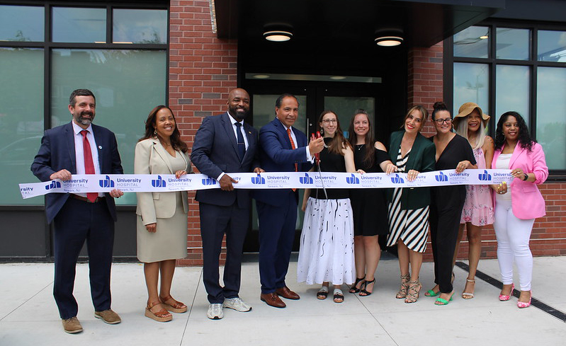 Cutting the ribbon on University Hospital's first health and wellness center in Newark are, from left: Jeff Brown, deputy commissioner of health; Tanya Freeman, chair, University Hospital board of directors; Dupre Kelly, Newark councilman; Ed Jimenez, University Hospital CEO and president; Melanie Walter, executive director, NJ Housing and Mortgage Finance Agency; Jacquelyn Suárez, commissioner, Department of Community Affairs; Senate Majority Leader Teresa Ruiz, D-29th District; Assemblywoman Eliana Pintor-Marin, D-29th District; Gee Cureton, West Ward district leader; and Ketlen Alsbrook, member, University Hospital board of directors.