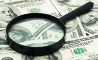 Magnifying glass and money