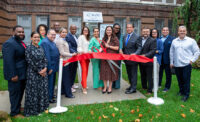 Officials cut the ribbon on the Saint James Health Center at East Side High School in Newark on Aug. 8, 2024.