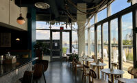 The new Blue Anchor Bar + Kitchen in Jersey City's Newport neighborhood spans over 2,200 square feet on the ground floor of The Beach, a waterfront residential tower developed by LeFrak.
