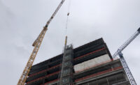 On Sept. 6, 2024, officials and stakeholders gathered in New Brunswick to celebrate the topping off of the H-1 building – the first of three to be constructed as part of the new HELIX (Health + Life Science Exchange) project.