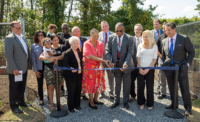 Community Medical Center, RWJBarnabas Health and Sadie Vickers Resource Center cut the ribbon on a new community garden in September 2024. From left: Thomas Hayes, director of New Jersey Natural Gas; Stacey Romano, branch manager, M&T Bank; Johanna Grant and Derrick Grant, community members; Assemblyman Carmen Amato, R-9th District; Barbara Crea, director of the Ocean County Board of Commissioners; Chaplain Barbara Miles, Holy Temple Church of God in Christ; Assemblyman Brian Rumpf, R-9th District; Rev. David Graham, CEO, Sadie Vickers Community Center; Patrick Ahearn, CEO, Community Medical Center; Barbara Mintz, senior vice president, Healthy Living and Community Engagement, RWJBarnabas Health; Michael Colwell, agent, Ocean County Prosecutors Office; Kevin Santucci, police chief, Berkley Township; Mark Manigan, president and CEO, RWJBarnabas Health. - PROVIDED BY RWJBARNABAS HEALTH