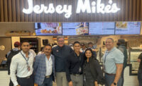 Jersey Mike’s Subs opened a new location at LaGuardia Airport on Oct. 3, 2024. Brian O’Hagan (third from left), vice president, business development, Jersey Mike’s Franchise Systems Inc., joined operator Manan Shah (fourth from left) and his family to celebrate the opening.