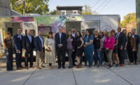 Elected officials, Cooper University Health Care staff and community partners at the unveiling of the Center for Healing's new mobile health services van.