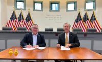 New Jersey American Water President Mark McDonough (left) and Manville Mayor Richard Onderko