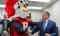 Rutgers mascot Sir Henry, the Scarlet Knight and JAG President and CEO John Gallucci Jr.
