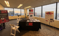 NJBIZ's booth at the 2024 Newark Summit, presented by roundtable&advisory. - JESSICA PERRY/NJBIZ