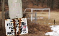 A no trespassing sign featured at the Dupont Pomptain Lakes site. - PROVIDED BY NEW JERSEY OAG
