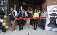 The eMazzanti team cuts the ribbon on the company's new headquarters at 724 Clinton St. in Hoboken.
