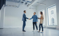 Real Estate Agent Showing a New Empty Office Space