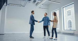 Real Estate Agent Showing a New Empty Office Space