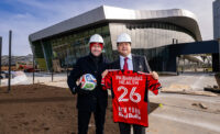 Marc de Grandpré, president and general manager, Red Bull New York, and Mark Manigan, president and CEO, RWJBarnabas Health, stand at the team's training facility in Morristown.